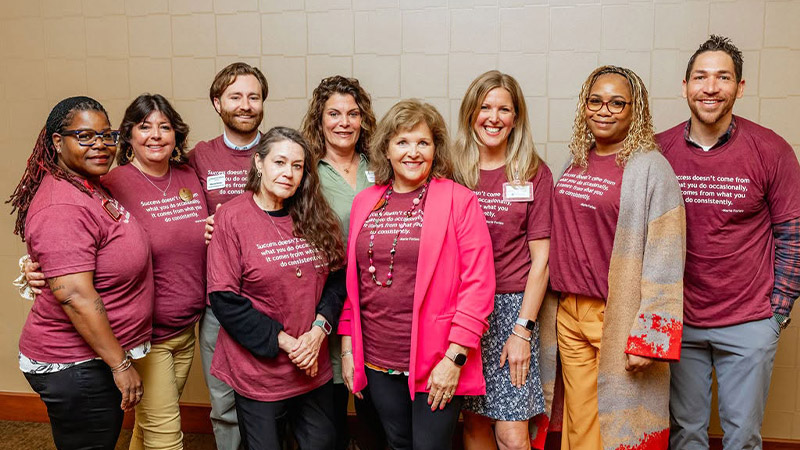 group of Traditions employees during the annual company meeting