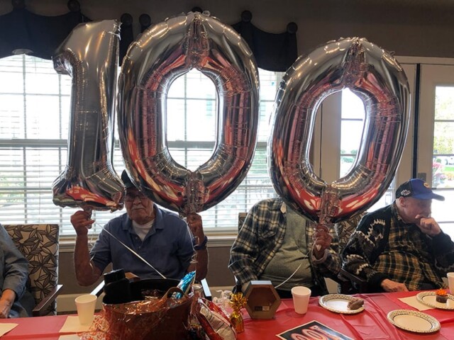Silver balloons showing the number 100